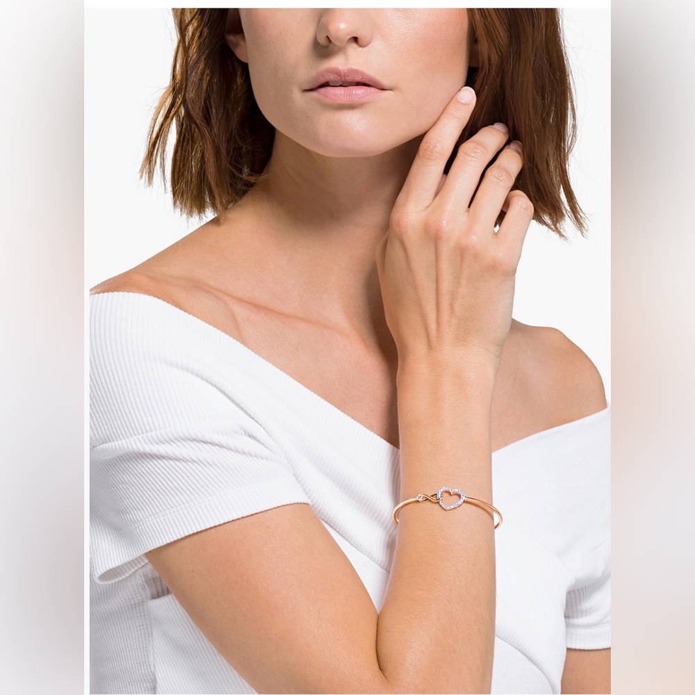 NIB Swarovski Hyperbola bangle, Infinity/heart, metal finish w/ white crystals.